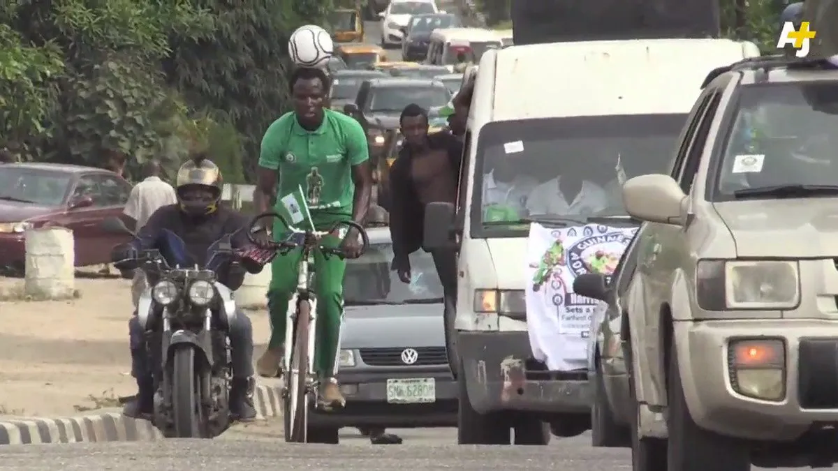 Harrison Chinedu cycling with a soccer ball balanced on his head in AJ+ footage